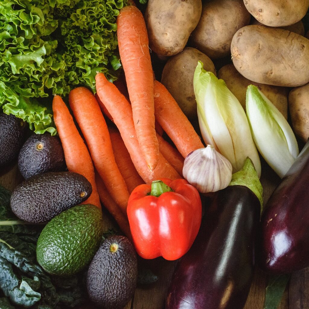 organic veg box - carrots and avocadoes